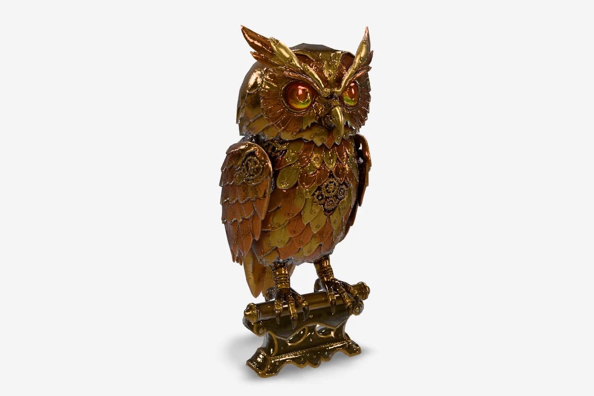 Ornate metallic owl sculpture